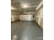 Attached garage with gray epoxy flooring and an automatic garage door opener at 412 Catawba Ave, Davidson, NC 28036