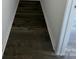 Long hallway with dark hardwood floors at 412 Catawba Ave, Davidson, NC 28036