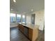 Kitchen island with granite countertops and stainless steel dishwasher at 412 Catawba Ave, Davidson, NC 28036