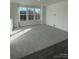 Spacious loft with gray carpeting and large windows offering natural light at 412 Catawba Ave, Davidson, NC 28036