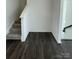 Modern staircase with dark gray carpeting at 412 Catawba Ave, Davidson, NC 28036