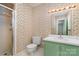 Small bathroom with shower, toilet and vintage style vanity at 422 Roselawn Pl, Charlotte, NC 28211