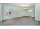 Bright bedroom with ample natural light and neutral colored walls at 422 Roselawn Pl, Charlotte, NC 28211