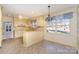 Kitchen with light yellow cabinets and a breakfast nook at 422 Roselawn Pl, Charlotte, NC 28211