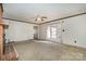 Bright living room featuring a fireplace and access to the backyard at 422 Roselawn Pl, Charlotte, NC 28211