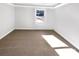 Well-lit bedroom featuring neutral walls and carpet at 502 Cherry St, Belmont, NC 28012