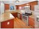 Kitchen with granite countertops and stainless steel appliances at 502 Cherry St, Belmont, NC 28012