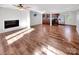 Open concept living room and kitchen with hardwood floors at 502 Cherry St, Belmont, NC 28012