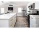 This modern kitchen boasts stainless steel appliances, a functional layout, and ample counter space at 680 Lake Head Rd, Norwood, NC 28128