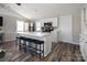 Bright and airy kitchen with white cabinets, a large island with seating, and stainless steel appliances at 680 Lake Head Rd, Norwood, NC 28128