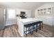 Modern kitchen with quartz countertops, stainless steel appliances, and stylish bar stool seating at 680 Lake Head Rd, Norwood, NC 28128