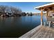 Stunning waterfront view from the property's private dock on a beautiful and serene day at 680 Lake Head Rd, Norwood, NC 28128