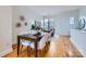 Modern dining area with hardwood floors and stylish table and chairs at 716 N Alexander St, Charlotte, NC 28202