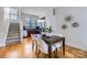 Open concept dining area with hardwood floors, kitchen and staircase view at 716 N Alexander St, Charlotte, NC 28202