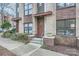 Townhome entry with brick facade, steps, and landscaping at 716 N Alexander St, Charlotte, NC 28202