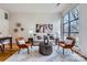 Modern living room with hardwood floors, large windows, and stylish decor at 716 N Alexander St, Charlotte, NC 28202