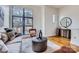 Spacious living area with hardwood floors, large windows, and comfortable seating at 716 N Alexander St, Charlotte, NC 28202