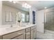 Double vanity bathroom with a large mirror and a separate shower at 7220 Hodges Meadow Ln, Charlotte, NC 28213