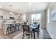 Kitchen dining area with table for six and access to patio at 7220 Hodges Meadow Ln, Charlotte, NC 28213