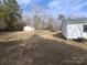 Large backyard with shed and mature trees at 796 S Lincoln S St, Dallas, NC 28034