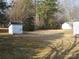 Large backyard with shed and mature trees at 796 S Lincoln S St, Dallas, NC 28034