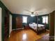 Bright bedroom with hardwood floors and a built-in dresser at 796 S Lincoln S St, Dallas, NC 28034