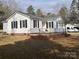 White Ranch home with deck and landscaping at 796 S Lincoln S St, Dallas, NC 28034