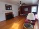 Living room with hardwood floors, fireplace and burgundy walls at 796 S Lincoln S St, Dallas, NC 28034