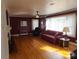 Living room with hardwood floors, fireplace and burgundy walls at 796 S Lincoln S St, Dallas, NC 28034