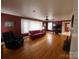 Living room with hardwood floors, fireplace, and burgundy walls at 796 S Lincoln S St, Dallas, NC 28034