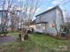 House back view with deck and landscaped yard at 8249 Chatham Oaks Dr, Concord, NC 28027