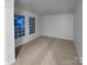 Bright living room with neutral carpeting and large windows at 8249 Chatham Oaks Dr, Concord, NC 28027