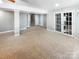 Spacious finished basement with carpet and french doors at 8806 Glenside St, Huntersville, NC 28078