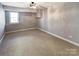 Finished basement room with neutral walls and carpet at 8806 Glenside St, Huntersville, NC 28078