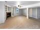 Spacious finished basement with built-in shelving and fireplace at 8806 Glenside St, Huntersville, NC 28078