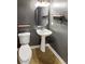 Small bathroom with pedestal sink, toilet and updated vanity at 8806 Glenside St, Huntersville, NC 28078