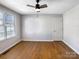 Simple bedroom with hardwood floors and neutral walls at 8806 Glenside St, Huntersville, NC 28078