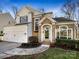 Two-story house with white siding, brick accents, and a two-car garage at 8806 Glenside St, Huntersville, NC 28078