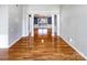 Bright hallway with hardwood floors leading to the dining room at 8806 Glenside St, Huntersville, NC 28078