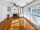 Living room featuring hardwood floors, a fireplace, and built-in shelving at 8806 Glenside St, Huntersville, NC 28078