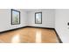 Comfortable bedroom featuring hardwood floors and two windows for natural light at 912 Hickory Grove Rd, Gastonia, NC 28056