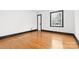 Cozy bedroom with hardwood floors and natural light streaming through a window at 912 Hickory Grove Rd, Gastonia, NC 28056