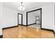 Open dining room showcasing hardwood floors and a view into the kitchen at 912 Hickory Grove Rd, Gastonia, NC 28056