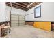 Empty garage space with garage door, window, and concrete floors at 912 Hickory Grove Rd, Gastonia, NC 28056