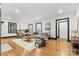 Bright living room with hardwood floors, neutral walls, and stylish furniture arrangement at 912 Hickory Grove Rd, Gastonia, NC 28056