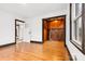 Open living room space features hardwood floors and views of a bonus room or sunroom at 912 Hickory Grove Rd, Gastonia, NC 28056