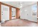 Charming brick sunroom with white beadboard ceiling, ceiling fan, and multiple windows and doors at 912 Hickory Grove Rd, Gastonia, NC 28056