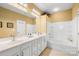 Elegant bathroom with double vanity and a soaking tub at 9813 Hanberry Blvd, Charlotte, NC 28213