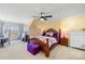 Large bedroom with a wooden bed frame and a private workspace at 9813 Hanberry Blvd, Charlotte, NC 28213