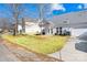 Rear view of the house, showcasing a patio and landscaped yard at 9813 Hanberry Blvd, Charlotte, NC 28213